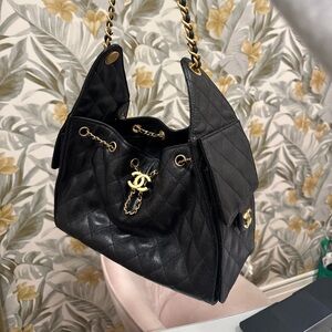 CHANEL 25 Small in Black grained calfskin with gold toned hardware. Full set.